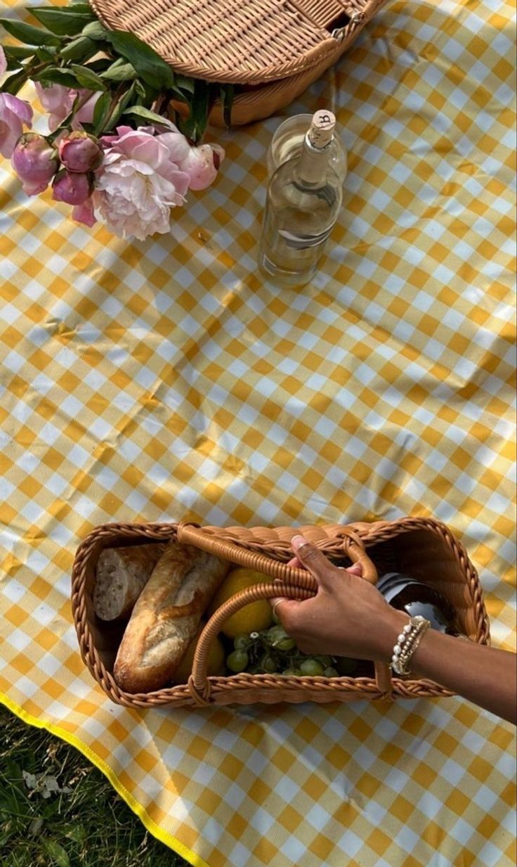 A yellow-gingham summer picnic with peonies and a wicker basket