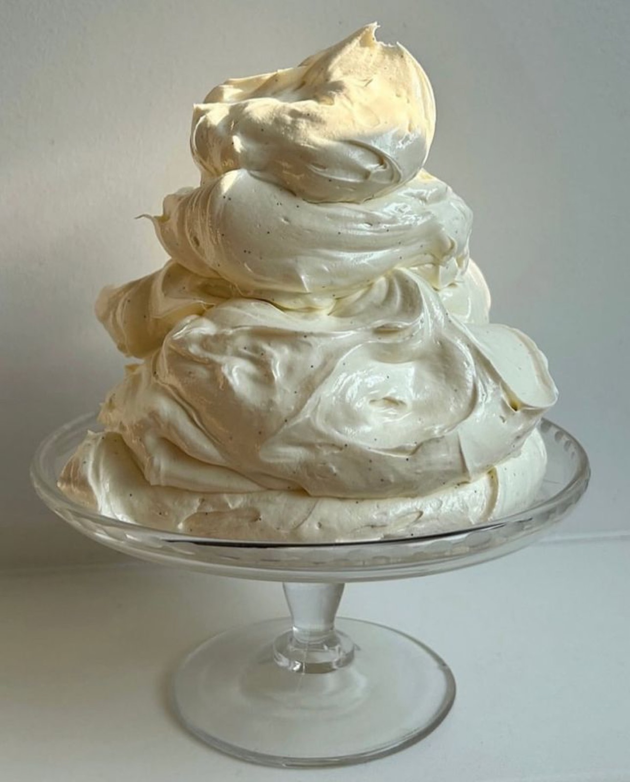 Vanilla meringue clouds on a glass stand