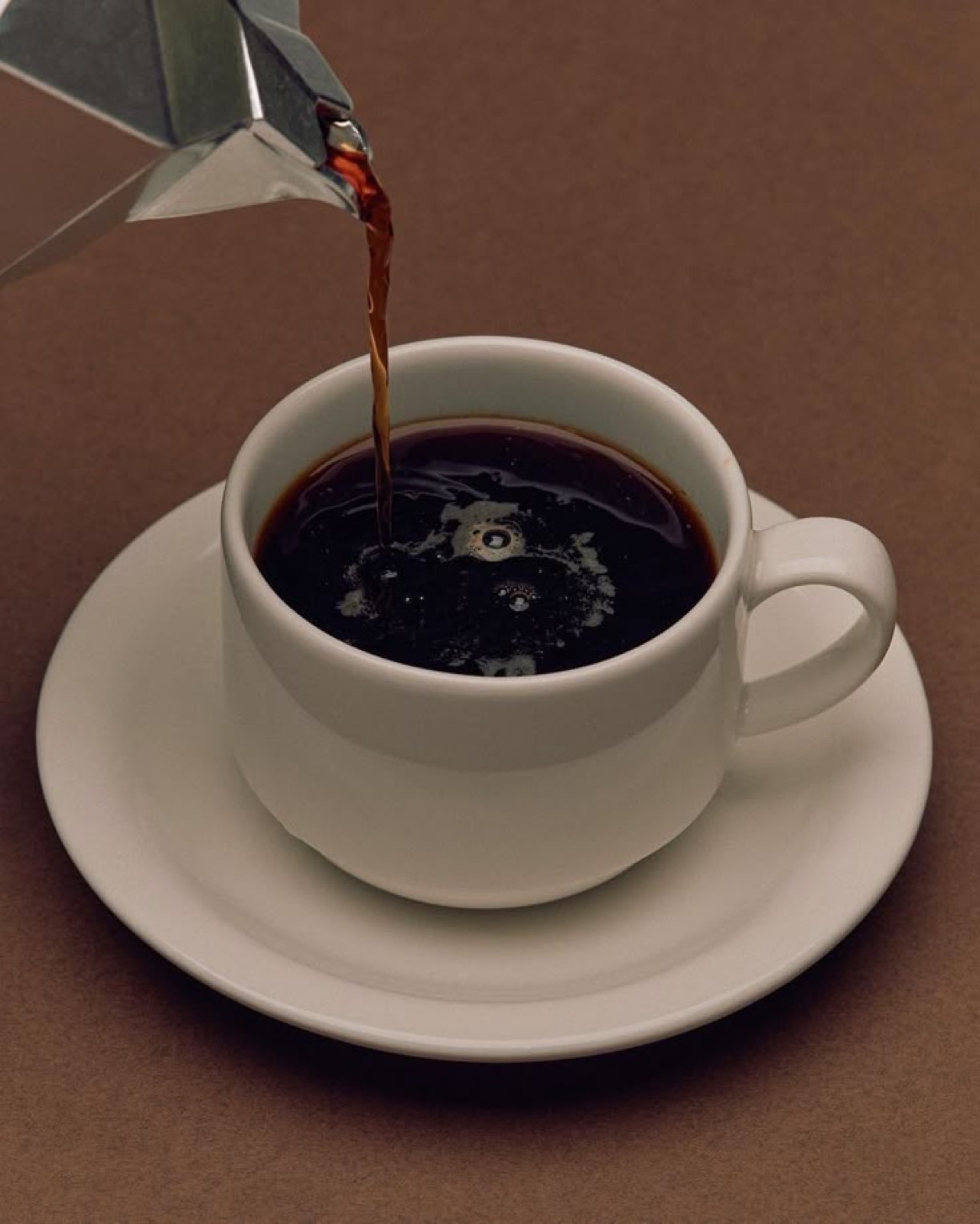 Coffee pouring from a moka pot